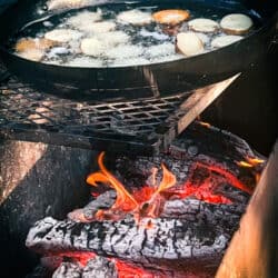 Steak Under the Stars frying over an open fire